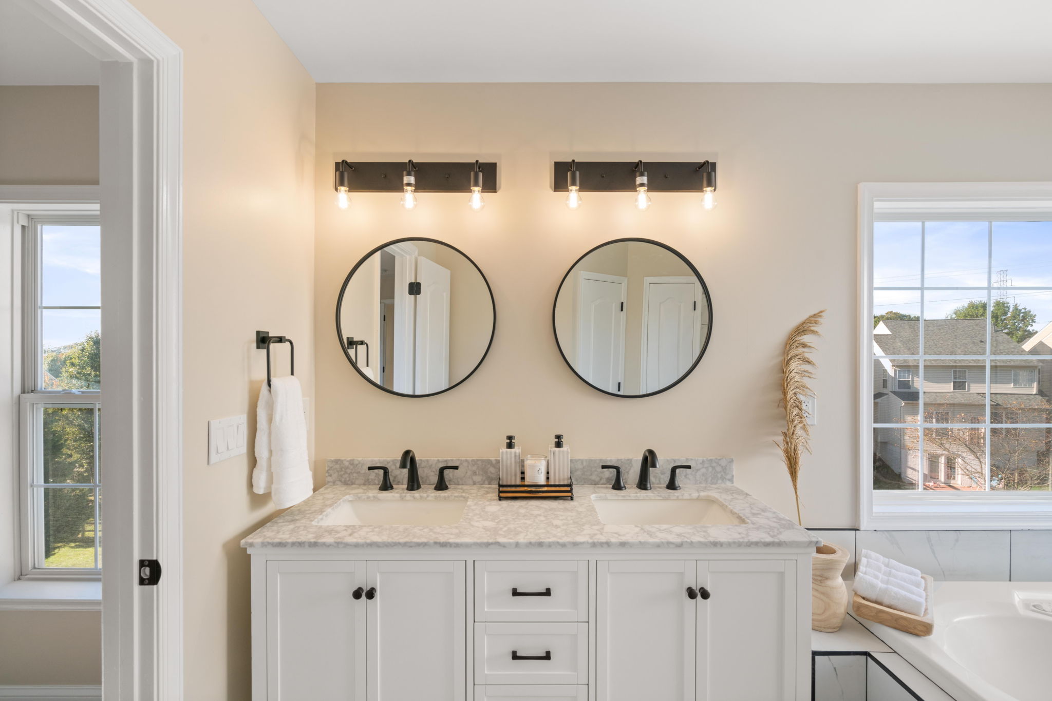 Primary Bathroom — Double Vanity, Round Mirrors, Matte Black Fixtures — JB Design and Renovations Dumfries VA