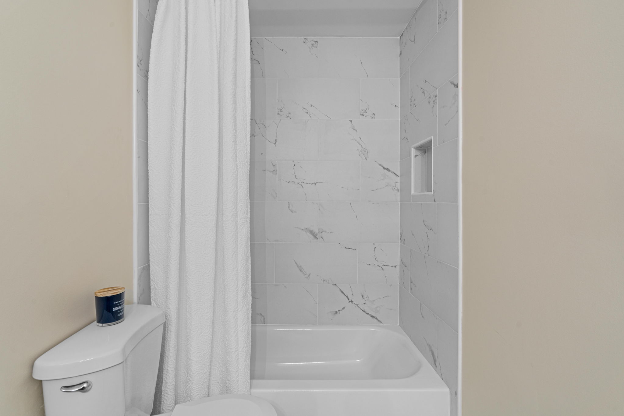 Hall Bathroom — Tub with Marble-Look Tile Surround — JB Design and Renovations Dumfries VA