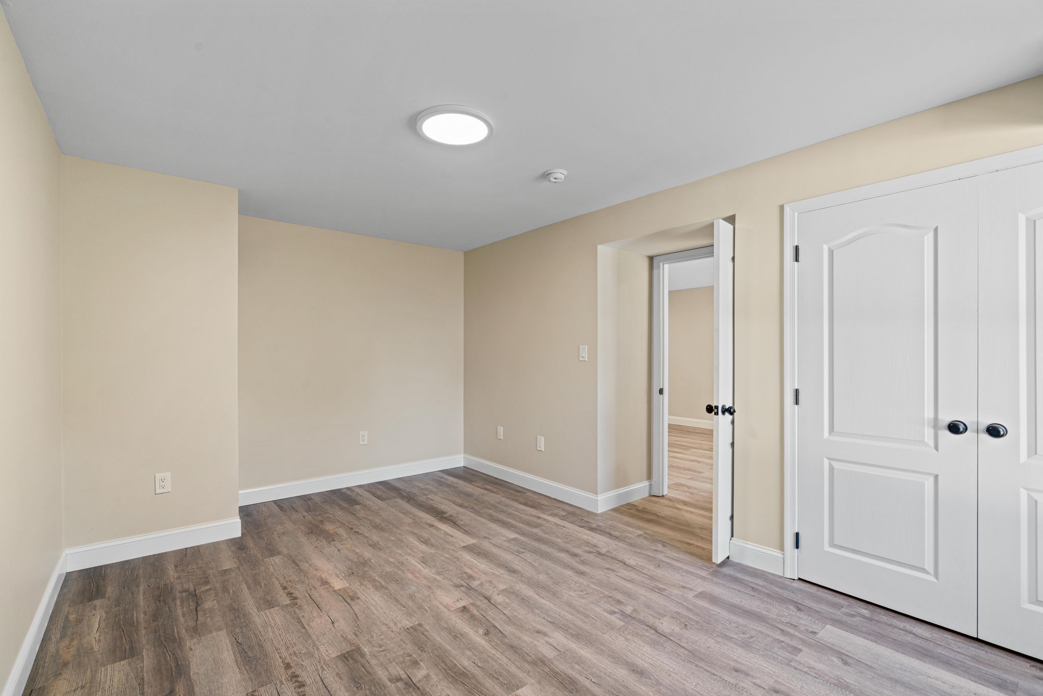 Basement Bedroom — LVP and Recessed Lighting — JB Design and Renovations Dumfries VA